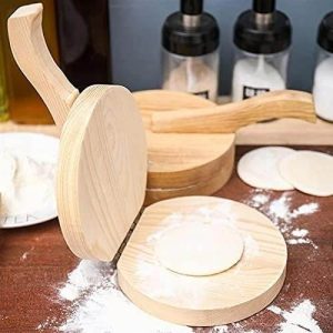 wooden dumpling presser