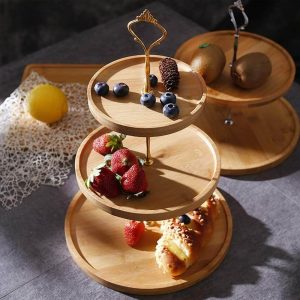 decorative cupcakes and fruit serving stand